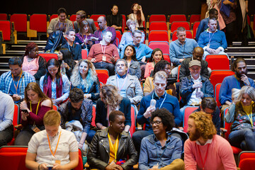 Audience arriving and sitting in auditorium