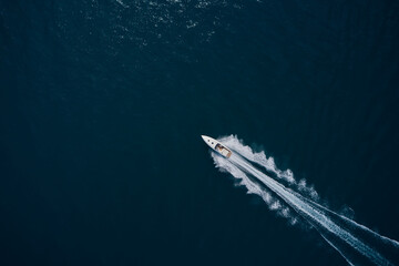 Speedboat wave speed water. Speed boat faster movement on the water top view. Speedboat movement on...