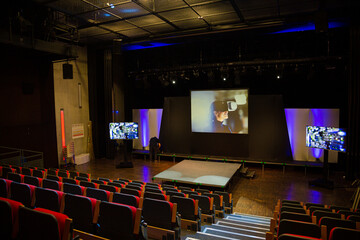 Naklejka premium Projection screens and seats in empty conference auditorium