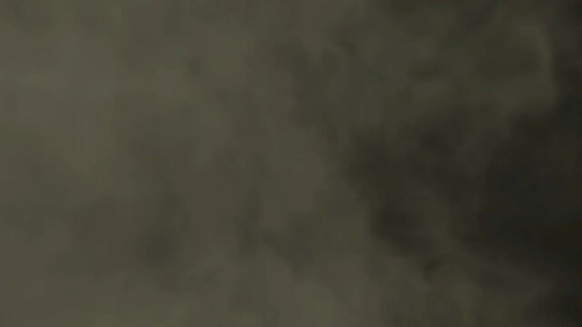 Smoke rushing towards the camera on a black background; visual element with Alpha, used for foreground when compositing.