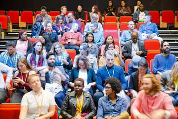 Audience arriving and sitting in auditorium