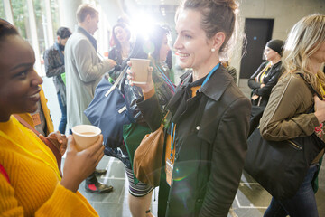 Woman drinking coffee during conference break