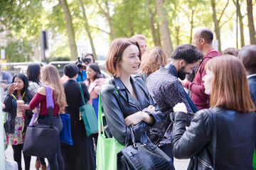 People talking outside auditorium