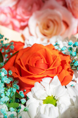 Bright beautiful bouquet red, yellow and pink of roses close up