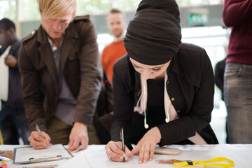 People signing up for conference