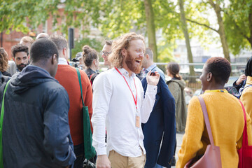 People talking outside auditorium