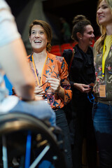 Audience talking to speaker in wheelchairs on stage