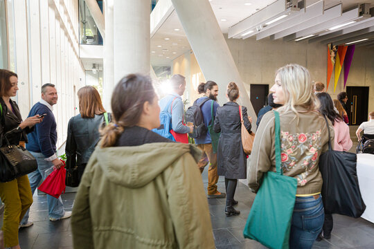 People entering auditorium hall