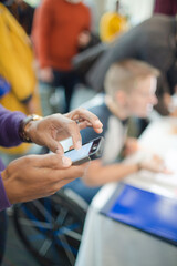 Man using smart phone during conference