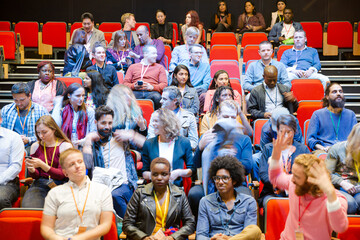 Audience arriving and sitting in auditorium