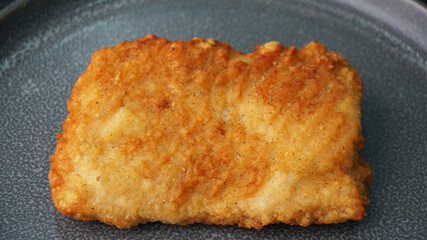 deep fried golden chicken chop cutlet fish fillet on dark grey wood background dim sum halal menu