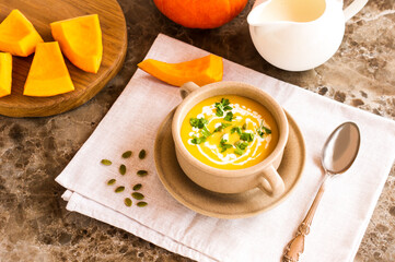 pumpkin soup puree with pumpkin seeds and parsley greens.healthy food.