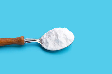 Baking soda on blue background.