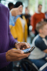 Man using smart phone during conference