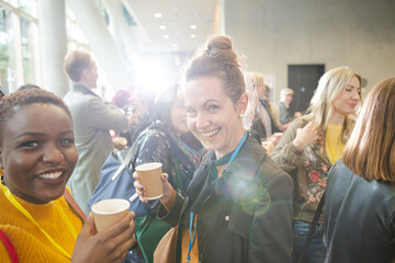 Women drinking coffee during conference break
