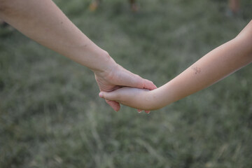 a two children holding hands.
