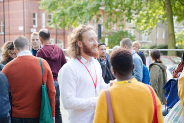 People talking outside auditorium