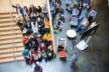 Obraz premium High angle view of people attending conference