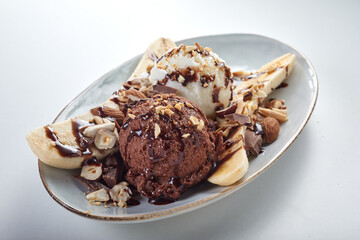 Tasty banana split dessert on plate