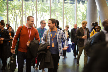 People arriving at conference hall