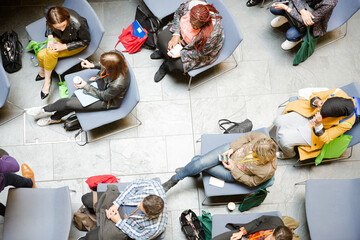HIgh angle view of people attending conference