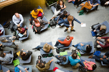 High angle view of people attending conference