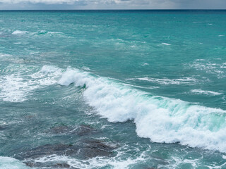 Fototapeta premium Beautiful view of ocean waves and a fantastic rocky shore, Sea patterns, background wallpaper.