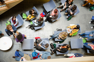 HIgh angle view of people attending conference