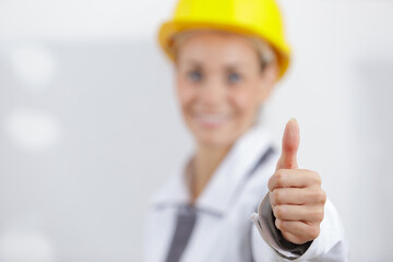 portrait of a successful woman and thumb-up