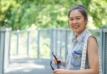 Smiling Asian woman despite awkward years