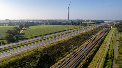 Motorway with few cars and railroad next to it, near the exit of Brecht in Belgium, Europe. High...