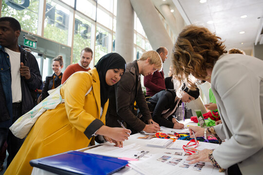People signing up for conference