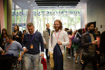 People arriving at conference hall
