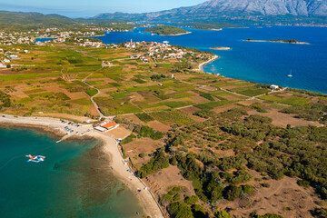 Aerial view of the beaches and fields near Lumbarda town on Korcula Island, Adriatic Sea in Croatia - obrazy, fototapety, plakaty