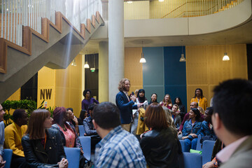 Audience watching male speaker