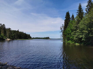 The Strait of Vyborg Bay between the island and the shore in the rocky natural park Monrepos of the city of Vyborg on a clear summer day.