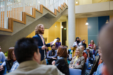 Audience watching male speaker