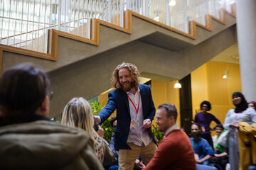 Speaker with microphone talking to audience