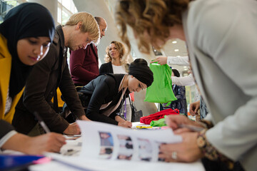 People signing up for conference