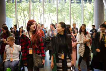 People arriving at conference hall