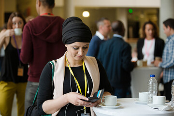 Smiling woman in hijab during conference break