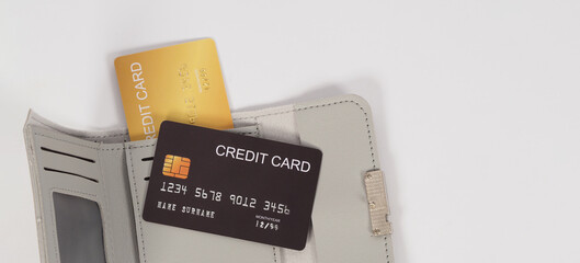 Credit card Black and gold color with in grey wallet isolated on white background..