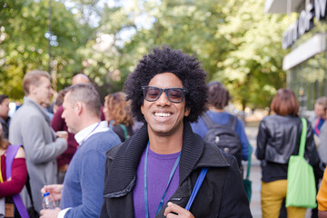 Smiling businessman during conference break