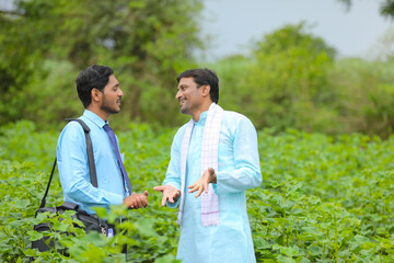 Indian farmer Discussing with agronomist at Farm and collecting some information