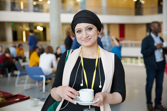 Smiling woman in hijab during conference break