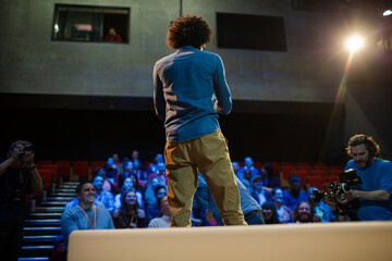 Audience watching speaker on stage