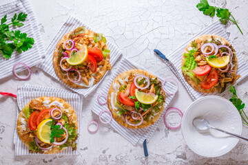 Greek gyros meat with pita flat bread, vegetables and onions and Tzatziki dip