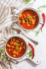 Beef goulash soup - hearty Hungarian soup of meat and vegetables seasoned with paprika