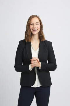 Portrait of a beautiful business woman folding her hands and smiling to the camera