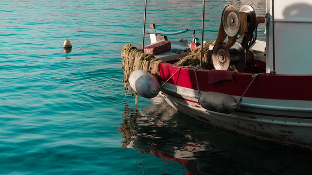 Fishing boat in blue water, fishing nets, old fisherman vessel
